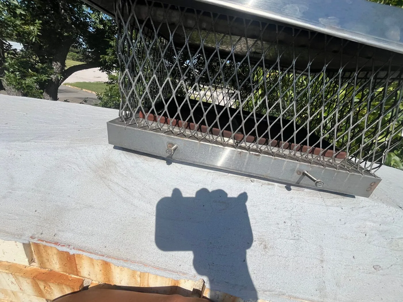 Chimney cap service — cap with mesh screen