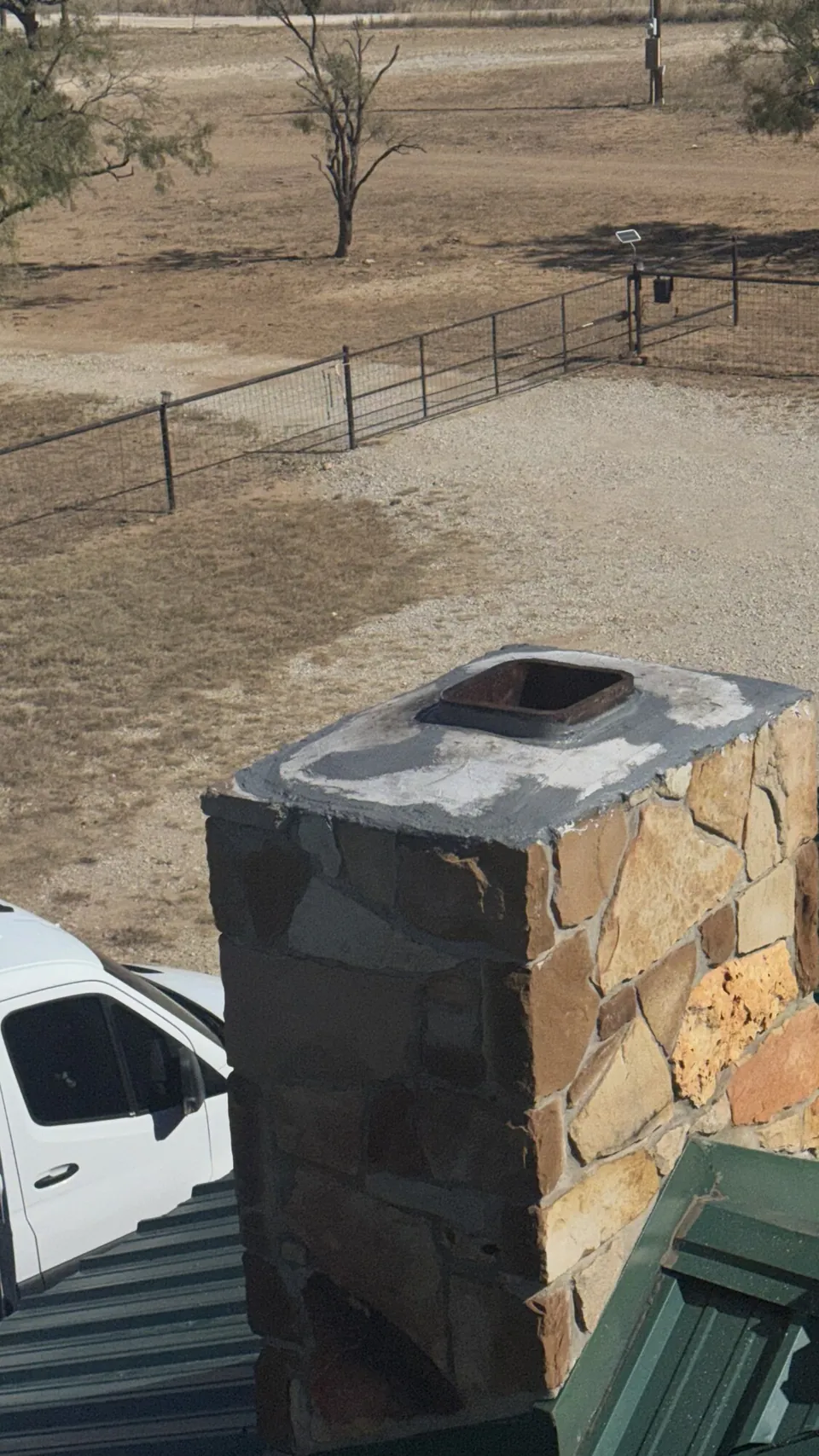 Chimney inspection — masonry stack above the roof