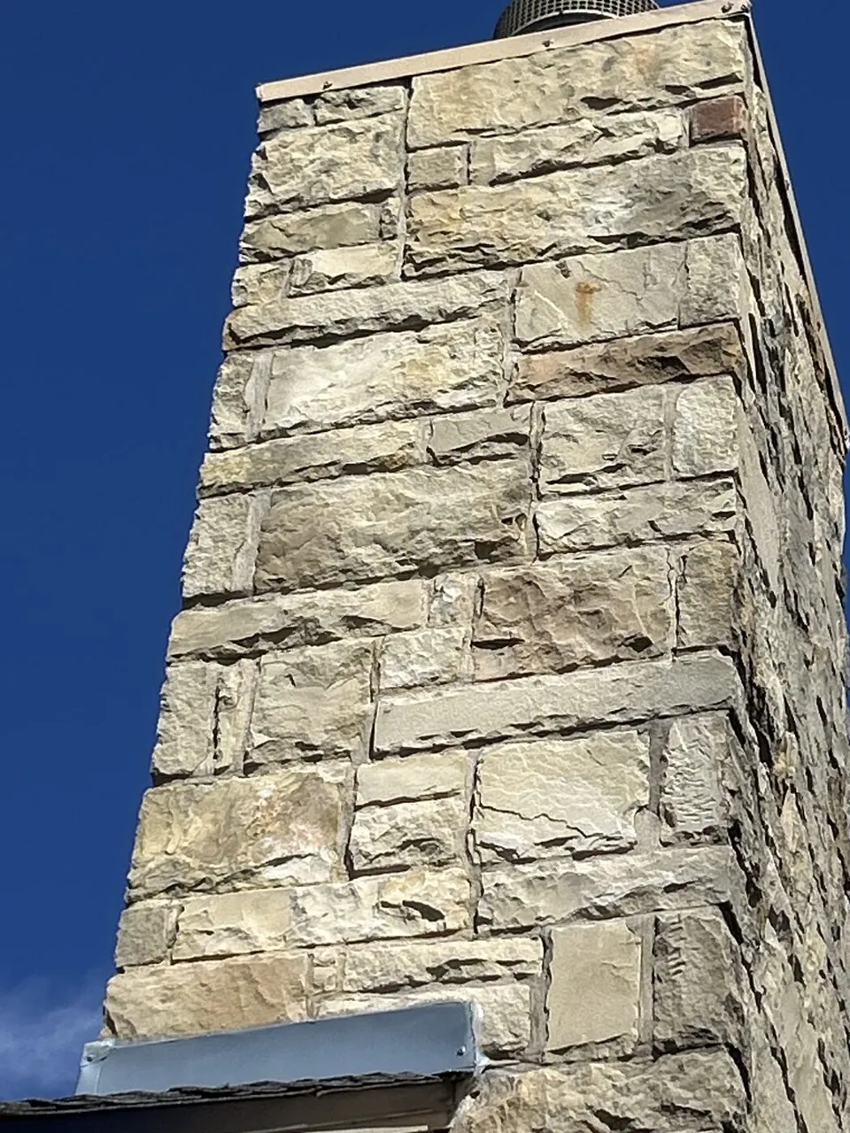 Masonry inspection — limestone chimney stack