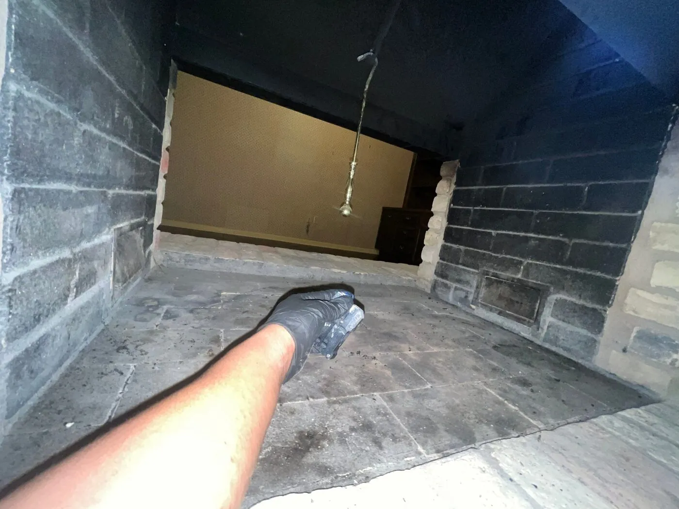 Fireplace service — firebox being vacuumed