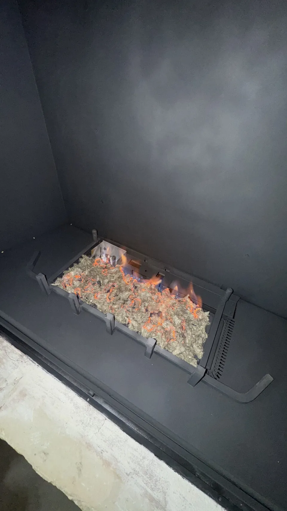 Gas fireplace service — ember bed in the burner tray