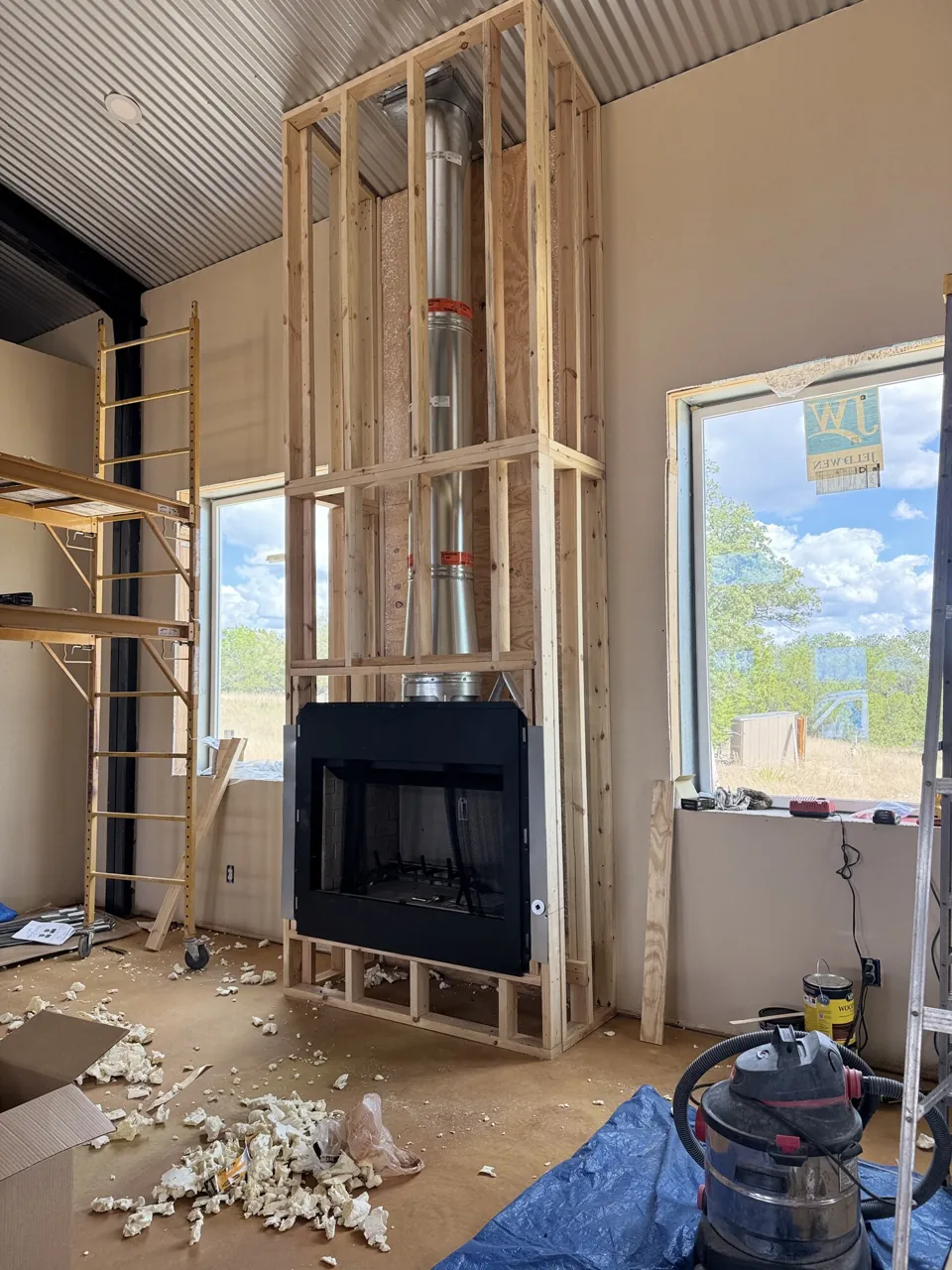 Fireplace installation — insert in open wall framing