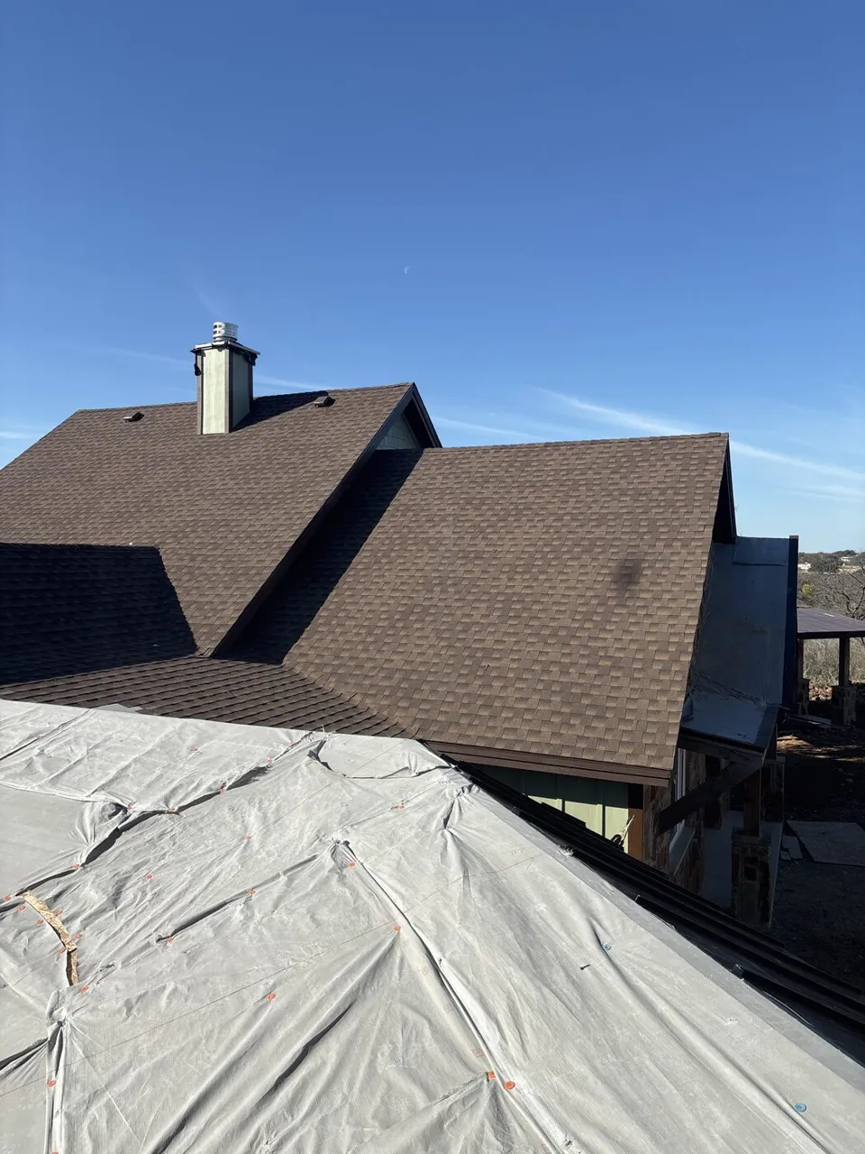 Chimney work — roof covered before service