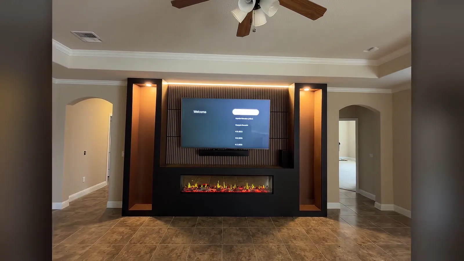 A finished media wall with a linear electric fireplace — the last stage of a real project
